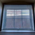 Room with a view of a cement wall